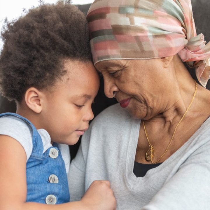 Palliative Care Senior woman with cancer hugging her grandchild